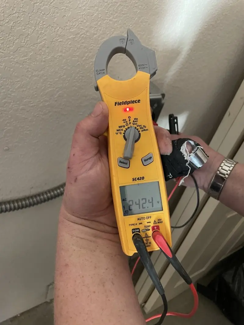 Voltage testing with clamp meter during Outlet Installation in Dilworth